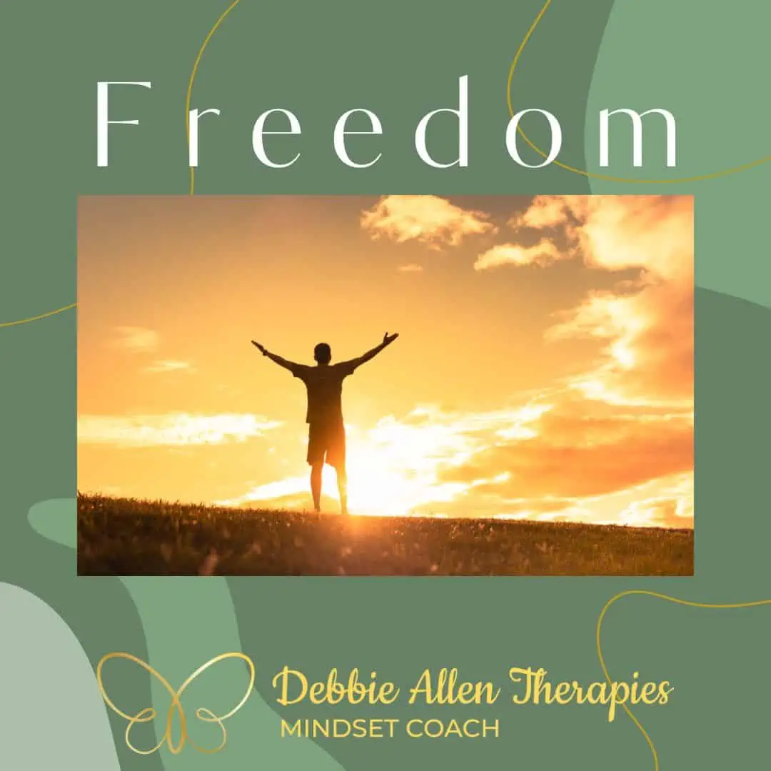 Blog image - Wording Freedom with Debbie Allen Therapies - Mindset Coach in gold with Gold line drawn butterfly and image of man standing in a field arms in air welcoming the sunrise.