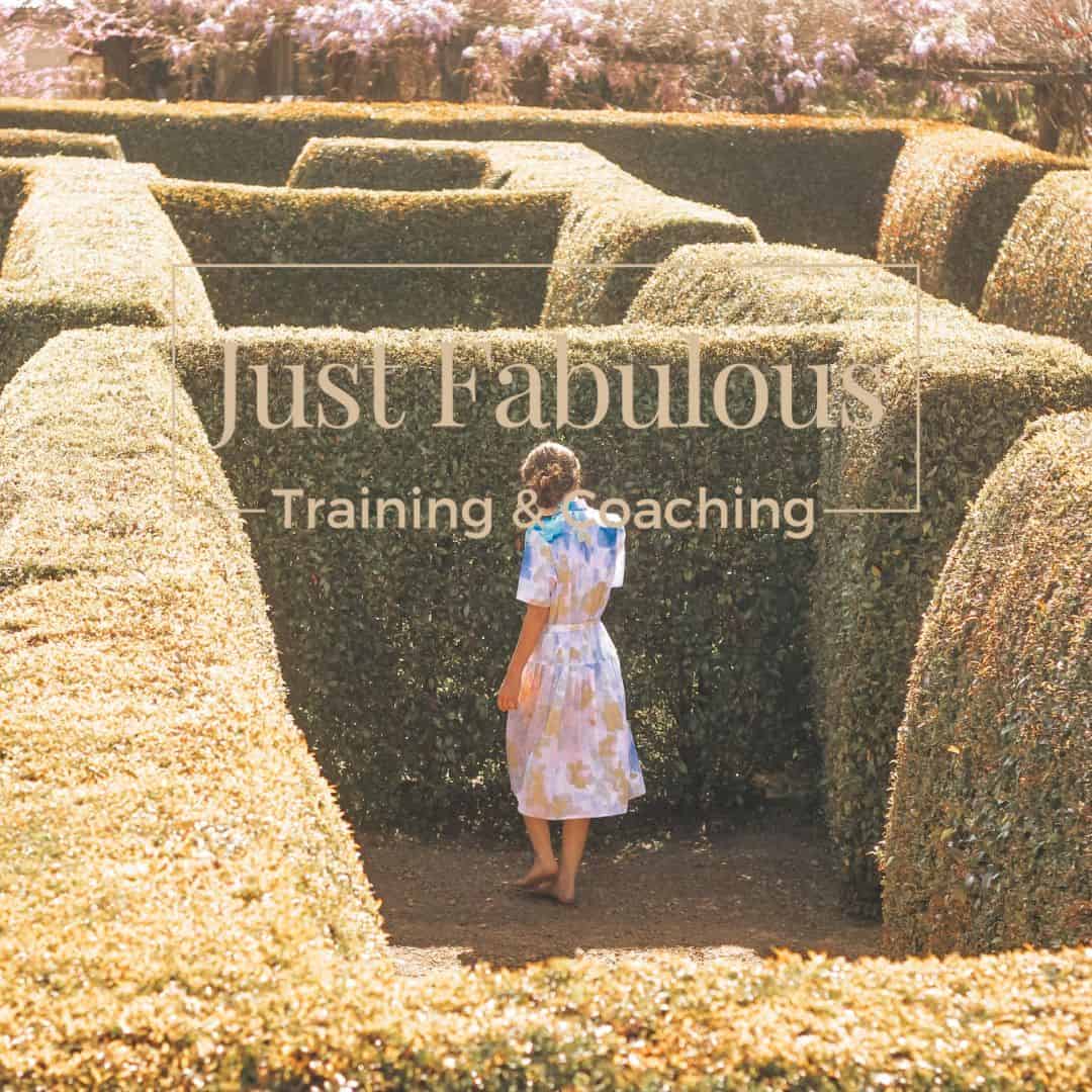 Image of a hedge maze with woman in summer dress at a dead end. Promoting Just Fabulous Training & Coaching Mindset Coaching by Debbie Allen helping Female Therapist entrepreneurs with confidence, overwhelm and anxiety